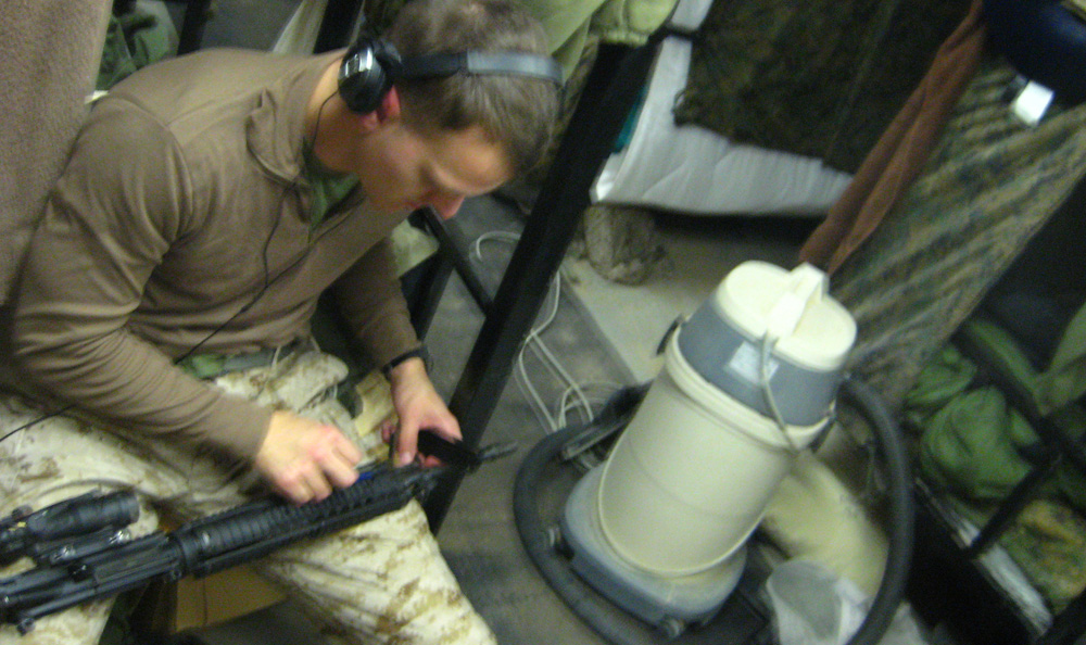 Weapons maintenance — mostly cleaning dust off
