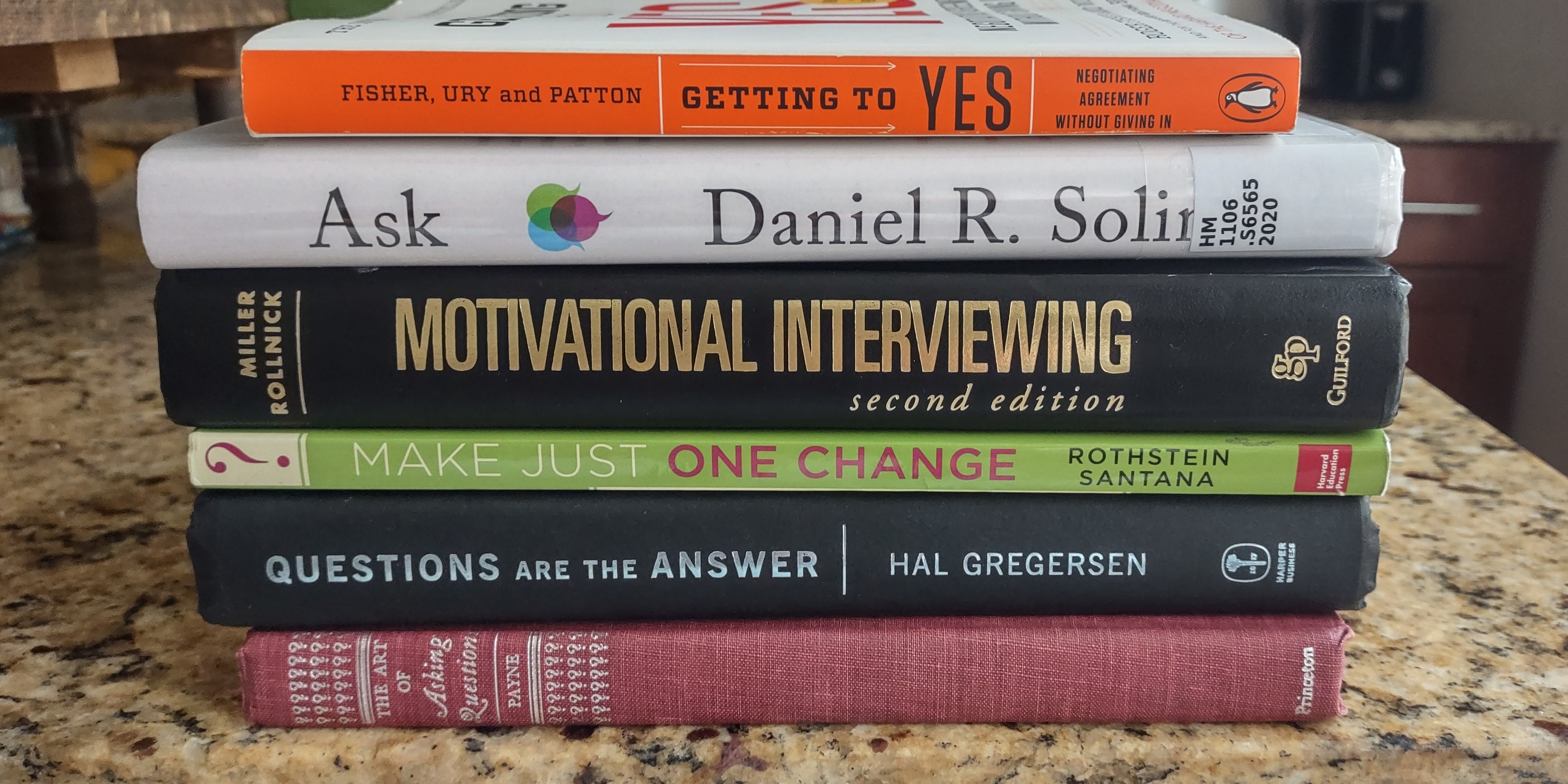 Stack of books on questioning techniques
